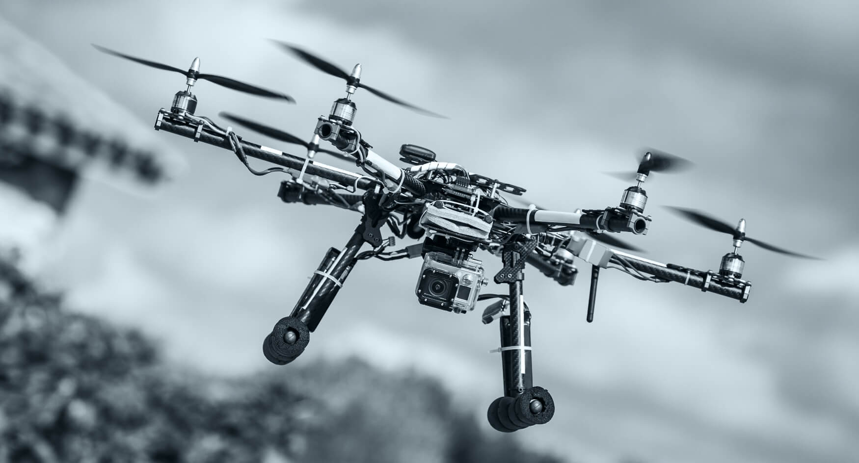 Professional camera drone in flight for aerial photography
